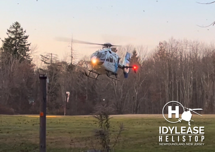 Air-medical helicopter approaching Idylease Helistop at dusk